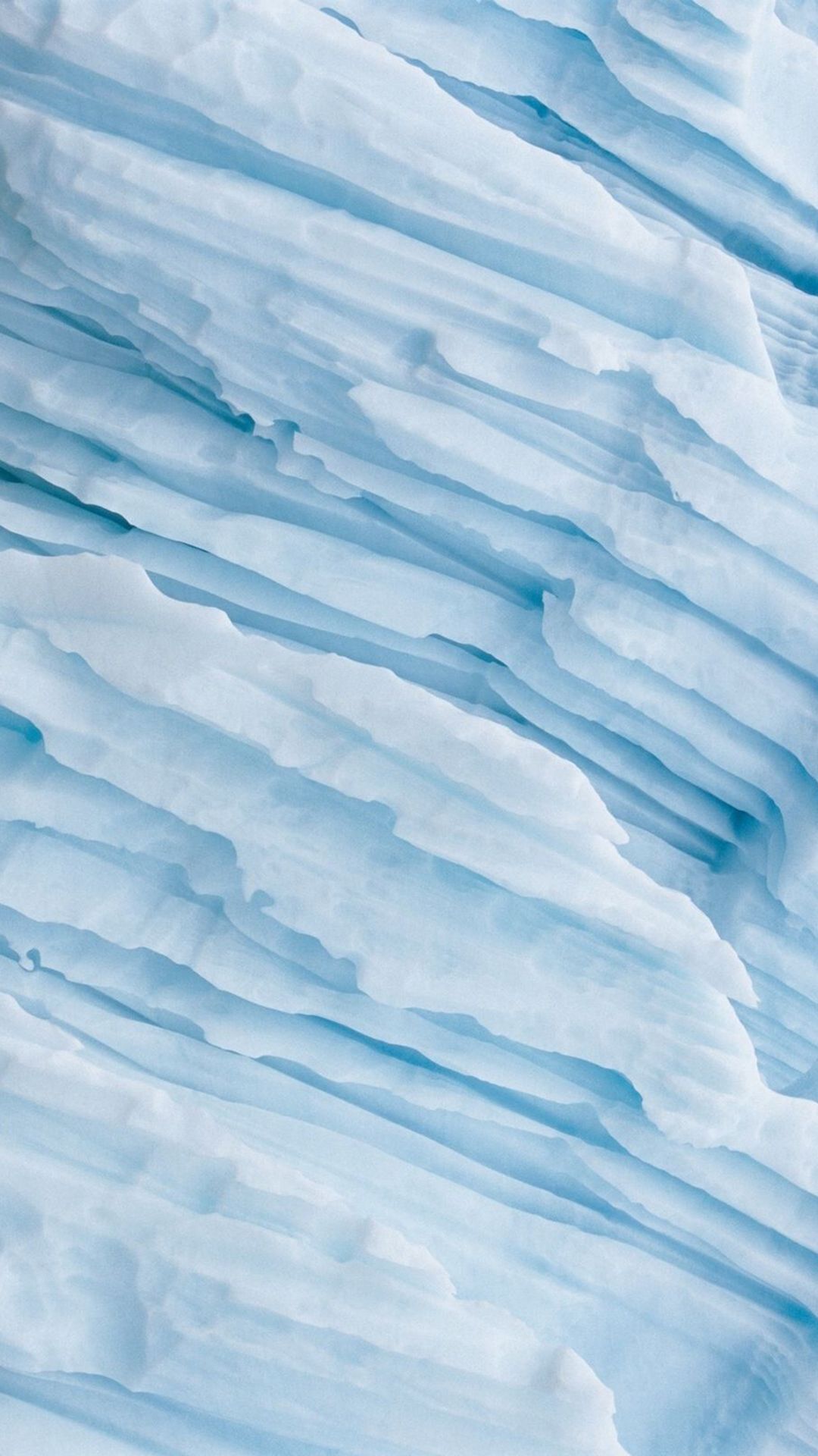 An abstract photo of ice formations on a glacier. - Light blue, pastel blue, ice
