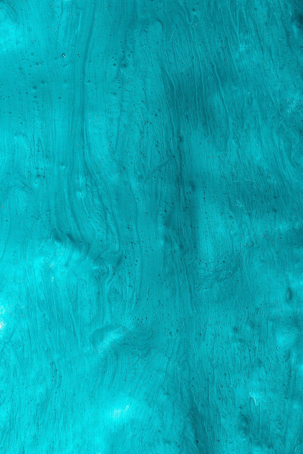 A close up of an aqua colored water - Turquoise