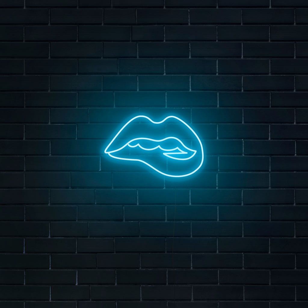 Neon sign of a mouth with blue neon lights on a brick wall - Turquoise