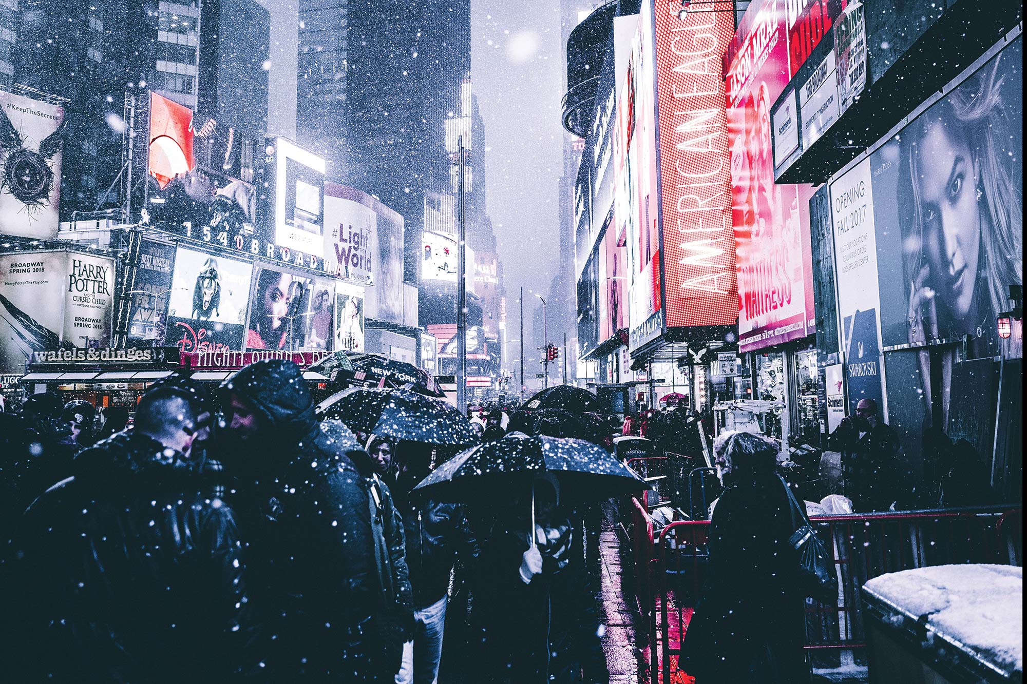 A busy street in New York City during a snowstorm - Broadway