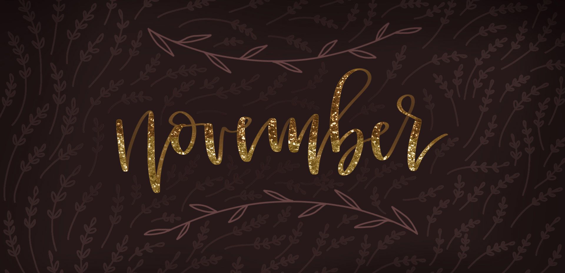 November, written in gold on a dark brown background with a pattern of branches - November