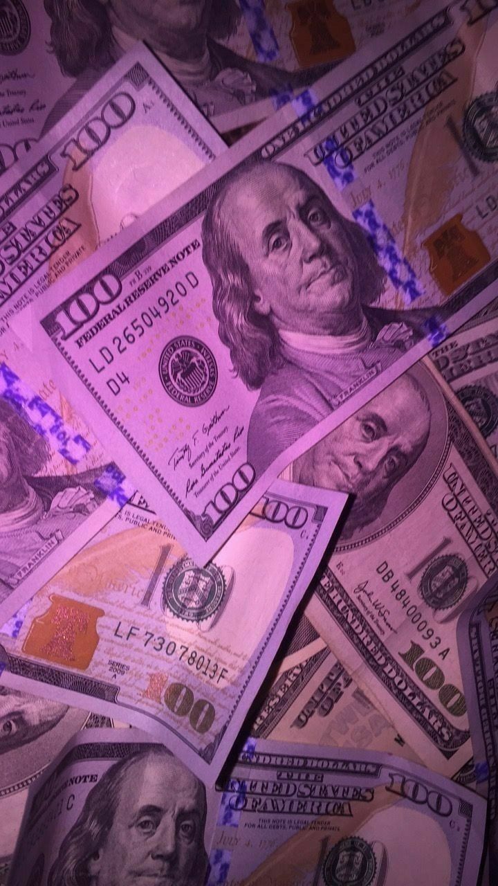 A close up of many hundred dollar bills - Money