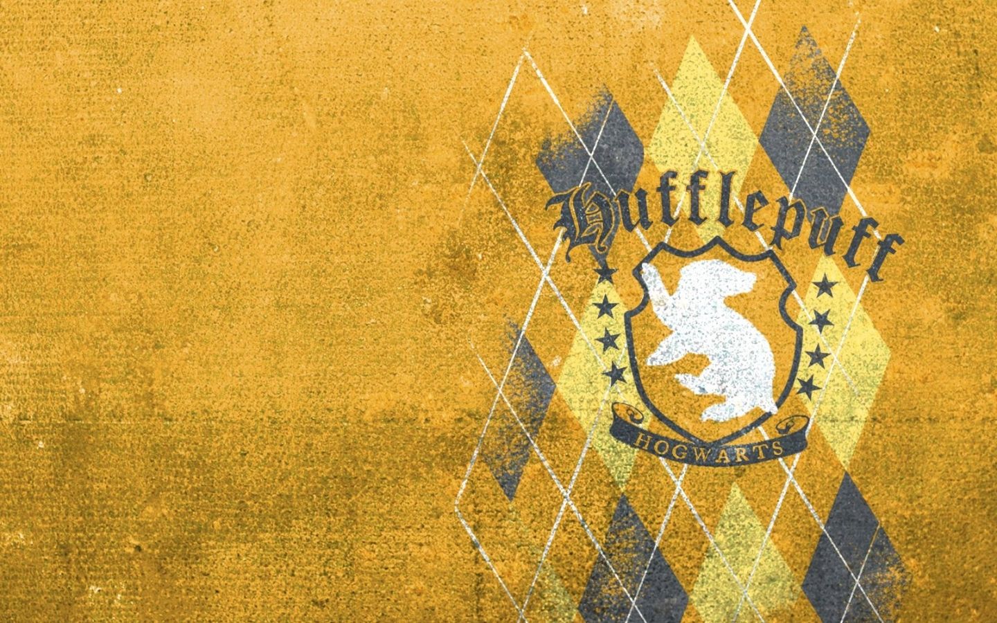 A yellow and black argyle pattern with the Hufflepuff crest in the middle - Hufflepuff