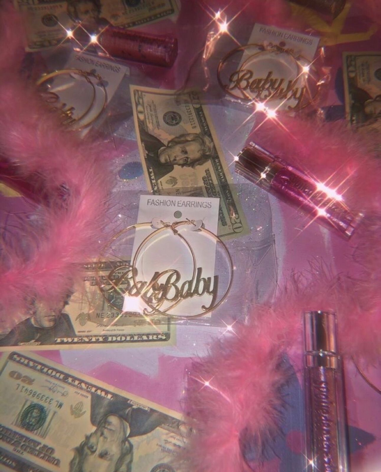 A pink feather boa and money on the table - Money