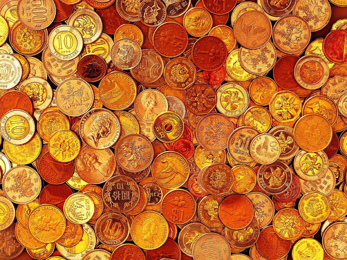 A pile of coins in various colors - Money