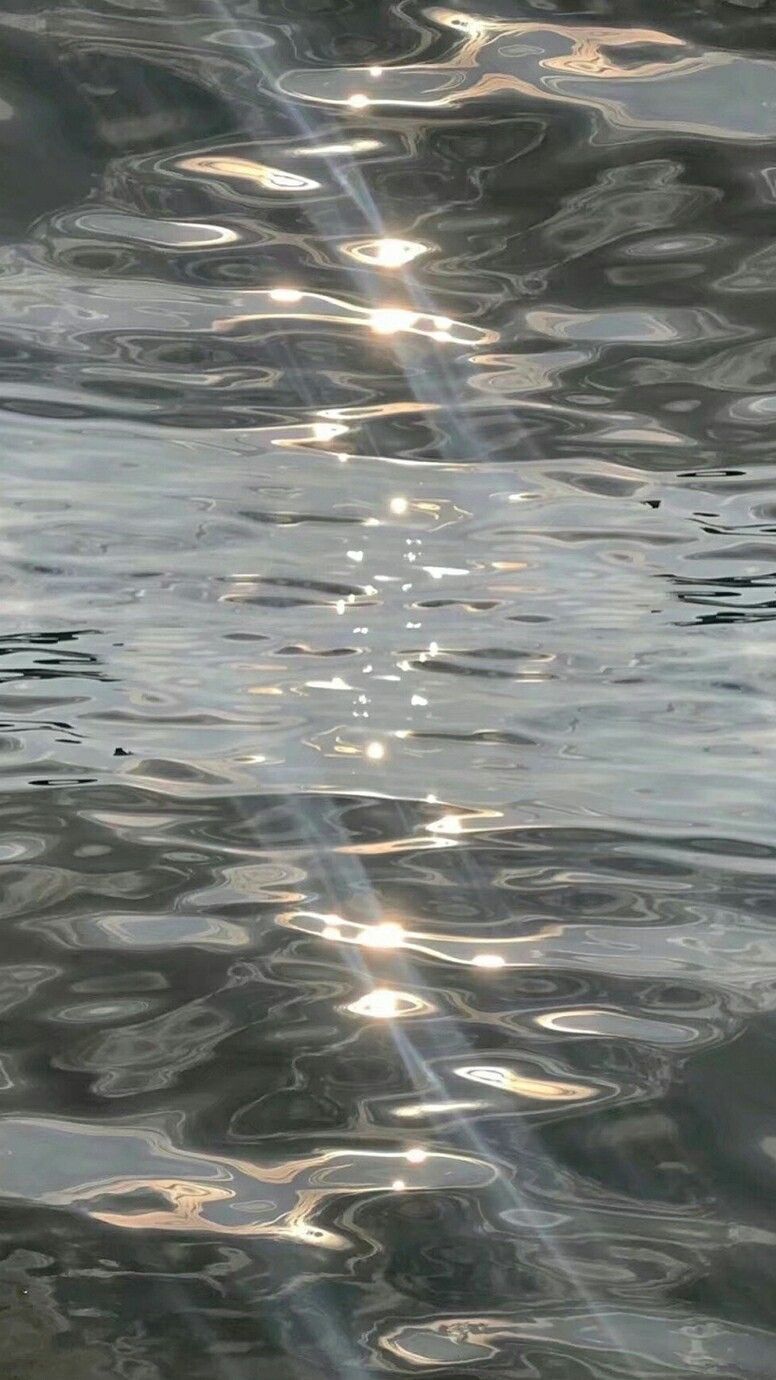 A reflection of the sun on water - Water