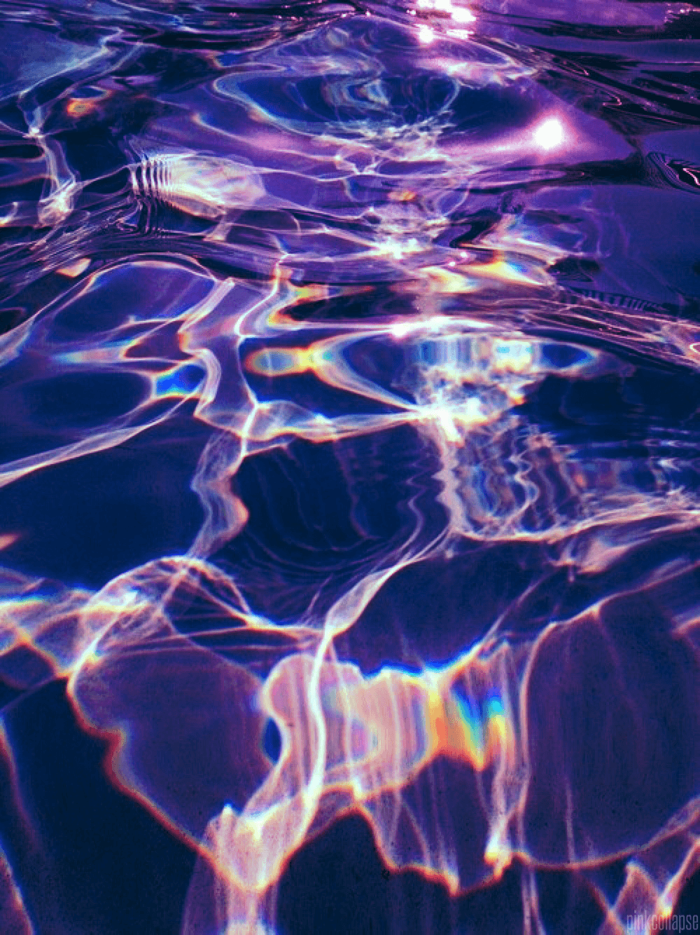 A purple water with light reflections on it - Water