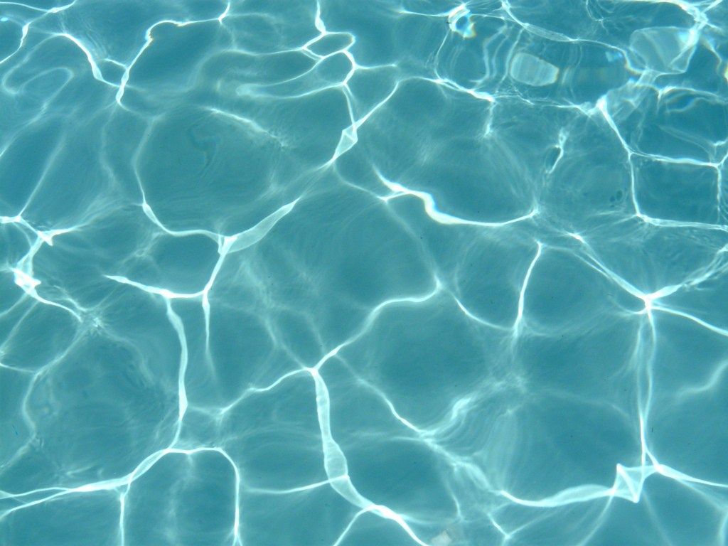 A close up of the water in an above ground pool - Water