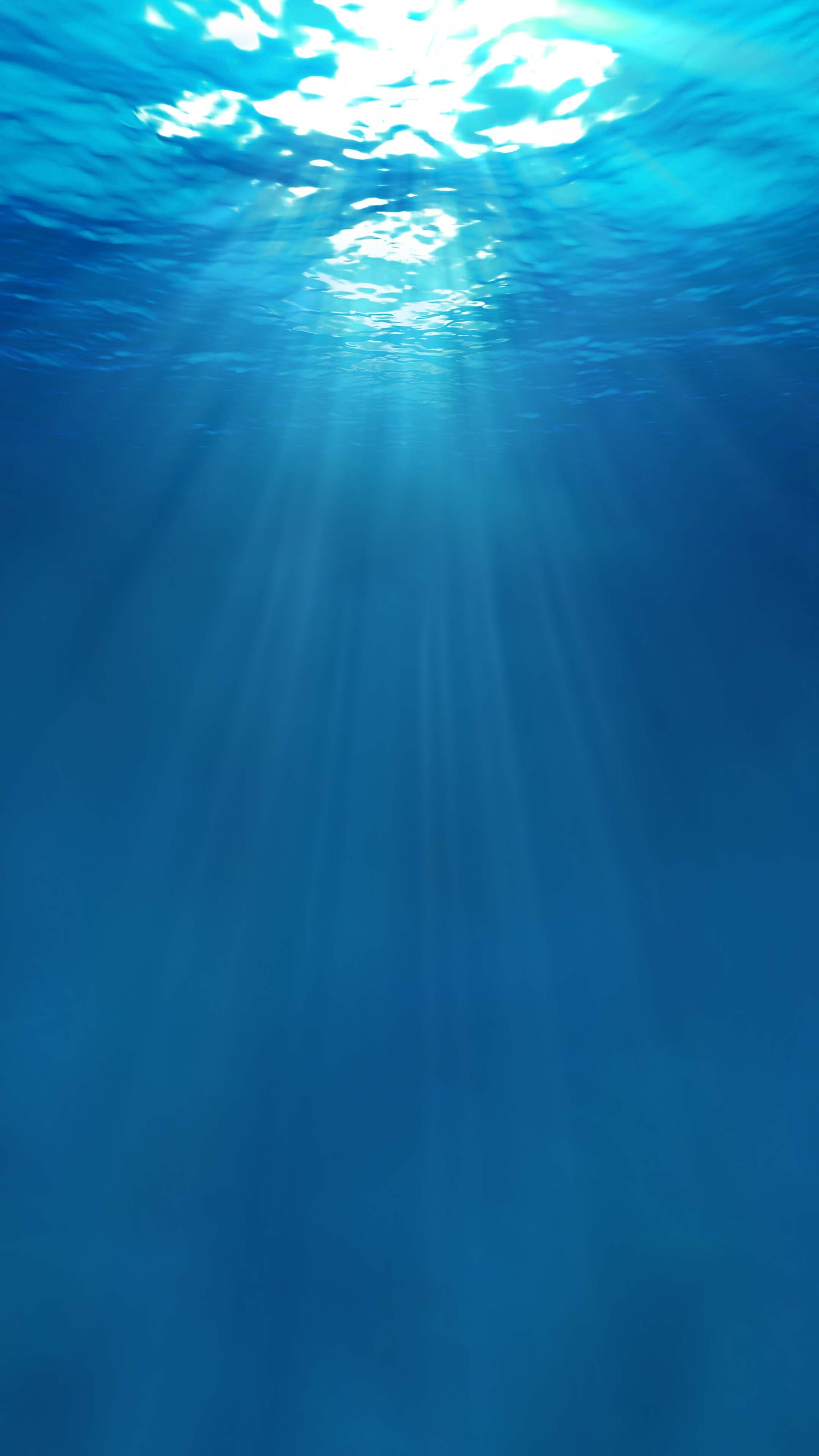 A sun ray is shining through the water - Water, underwater, ocean