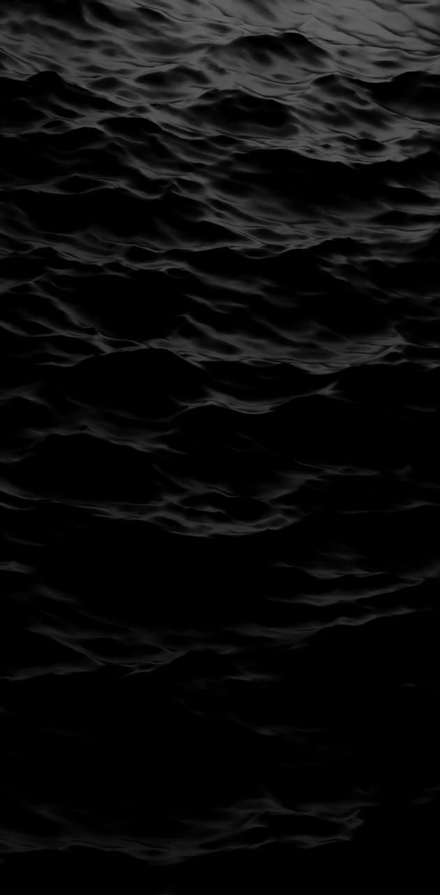 A black and white photo of the ocean - Water