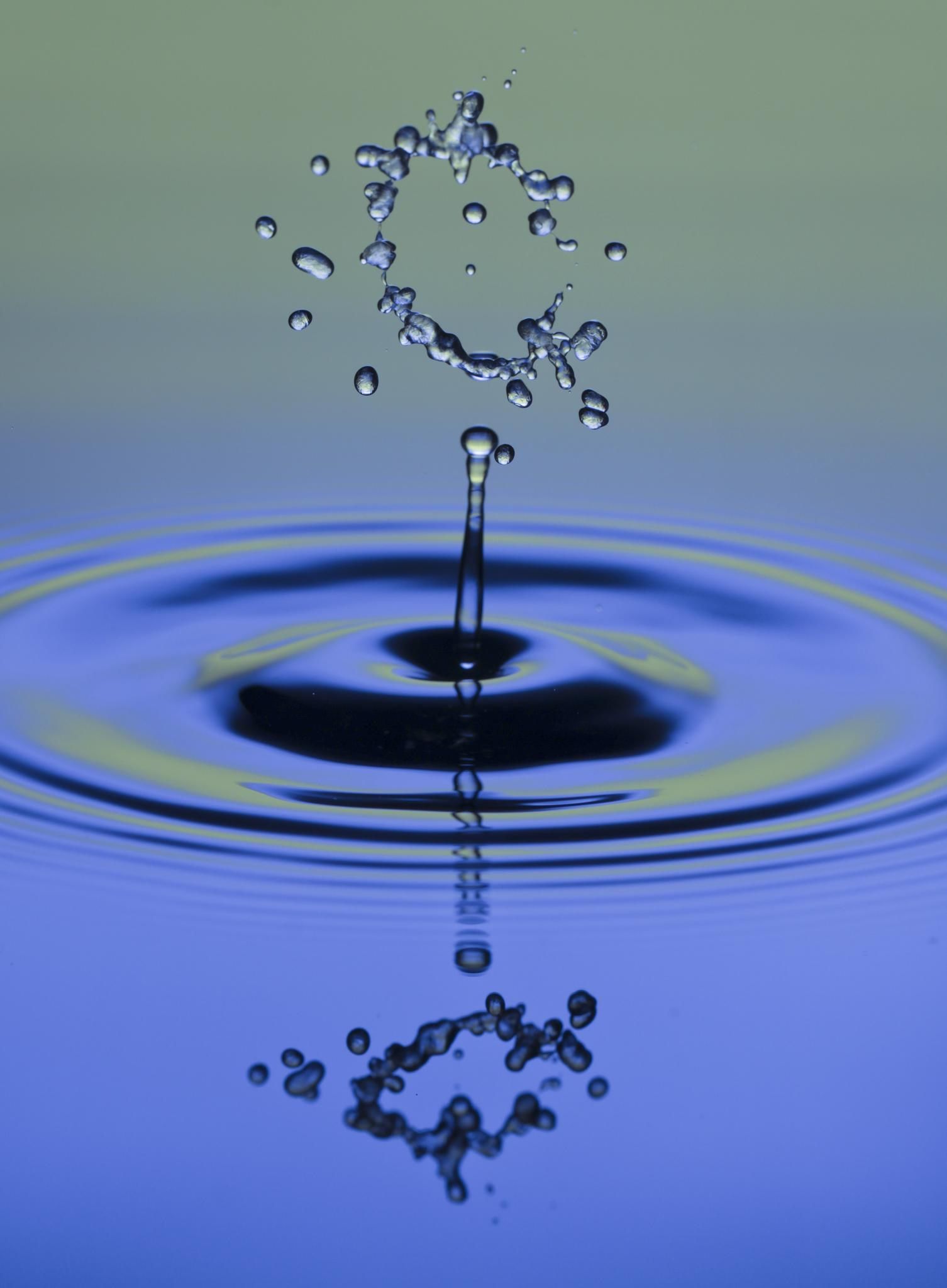 A water drop splashing into the air - Water