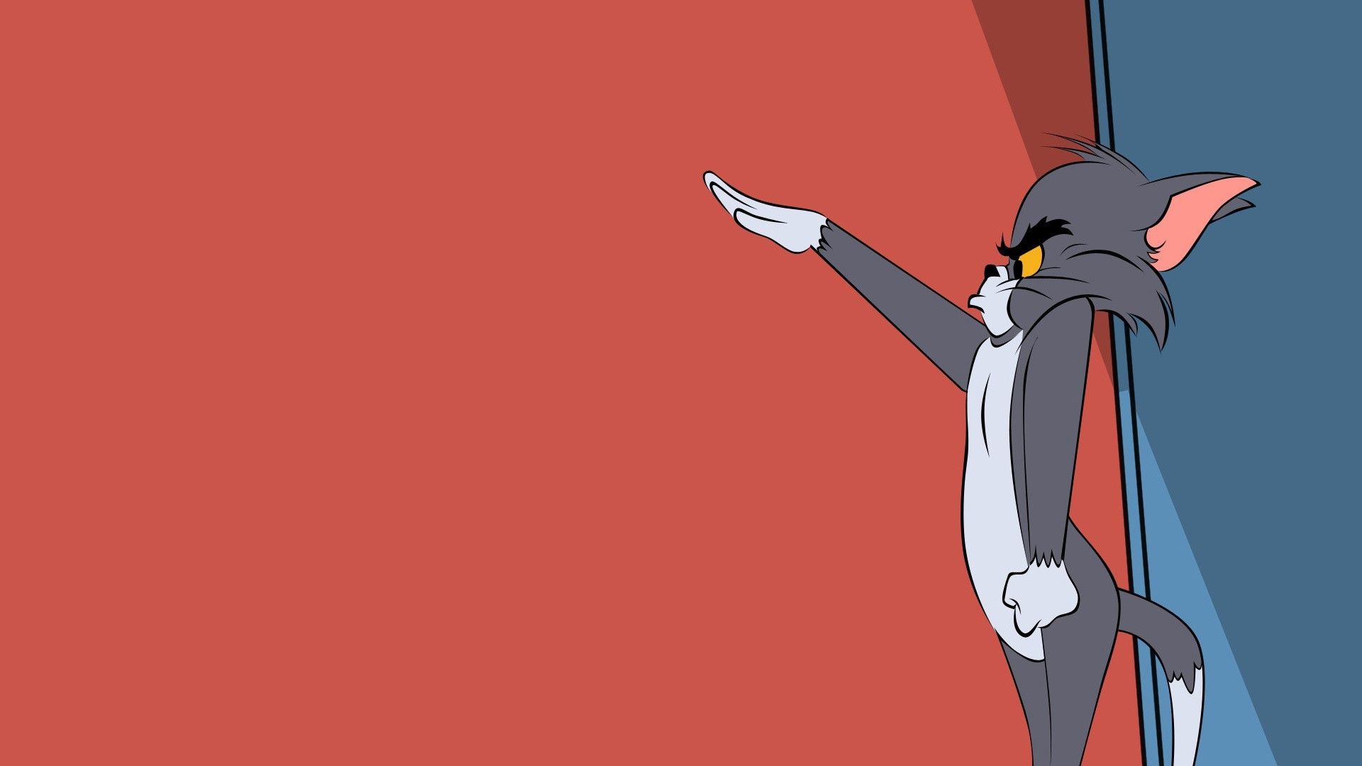 A cartoon cat pointing at something in the distance - Tom and Jerry