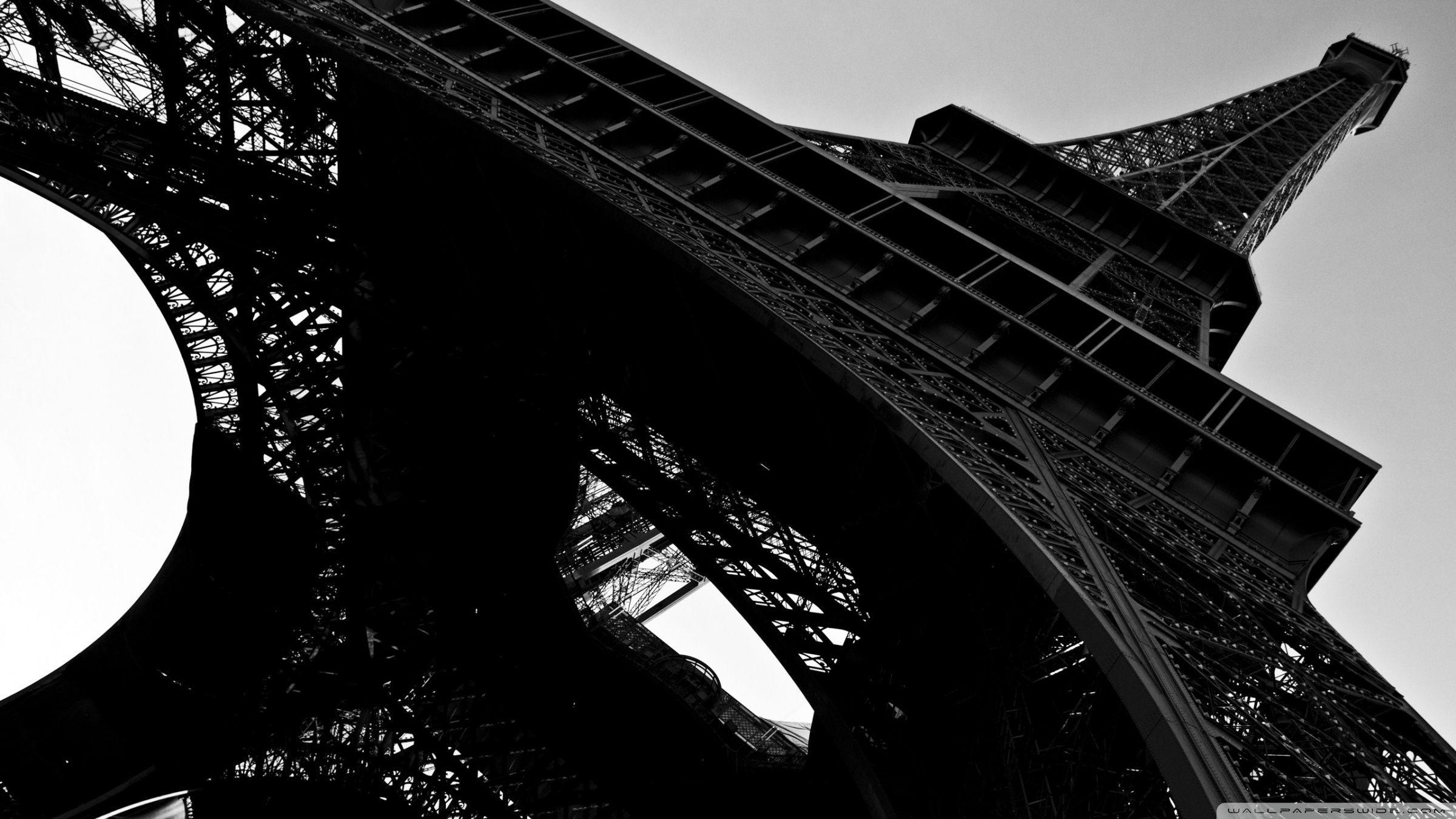 The Eiffel Tower is a wrought iron lattice tower on the Champ de Mars in Paris, France. It is named after the engineer Gustave Eiffel, whose company designed and built the tower. - Paris, Eiffel Tower