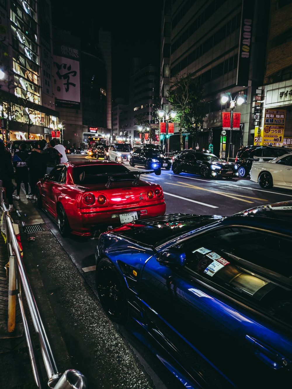 A group of cars parked on the sidewalk - JDM