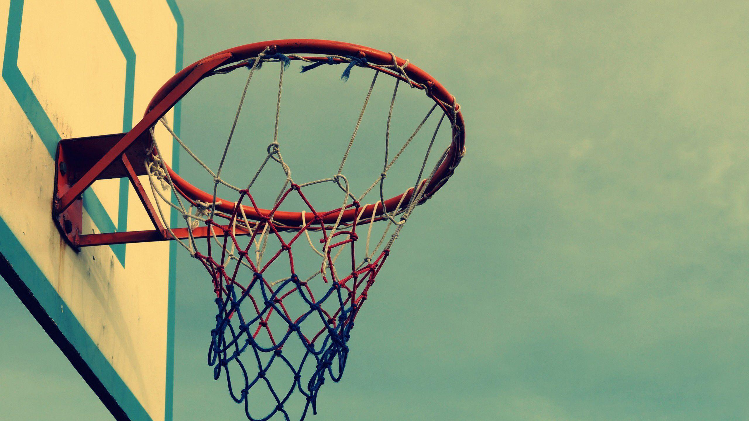 A basketball hoop with the net hanging down - Basketball