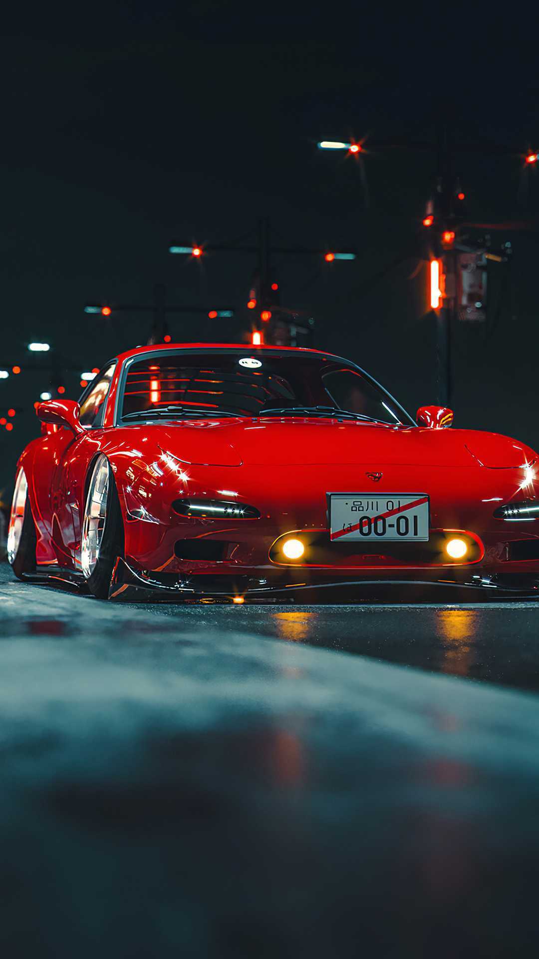 A red sports car driving down the street - JDM