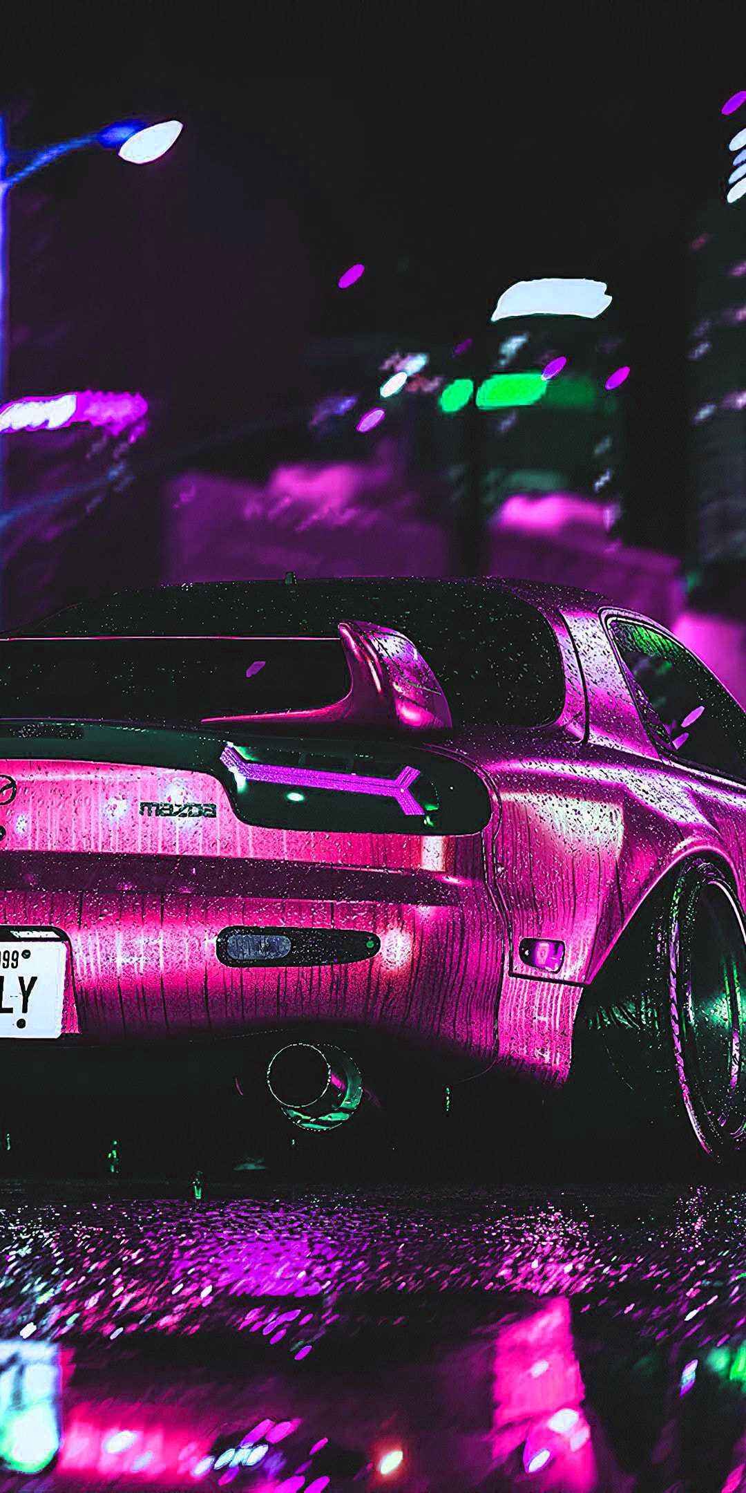 A pink car is parked in the rain - JDM