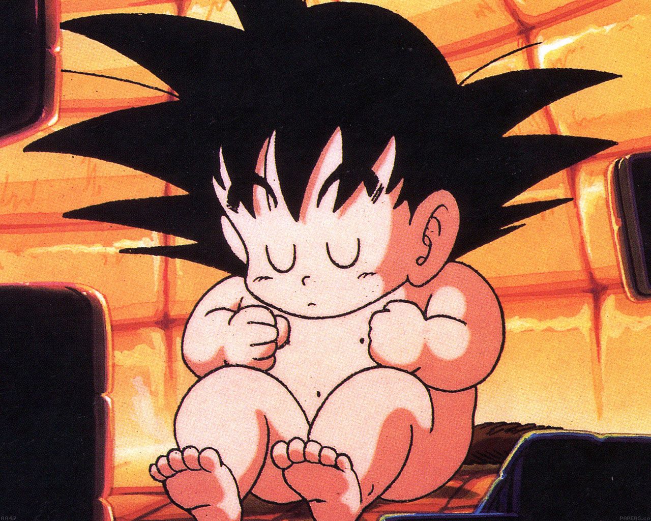 A cartoon of an infant with black hair - Goku