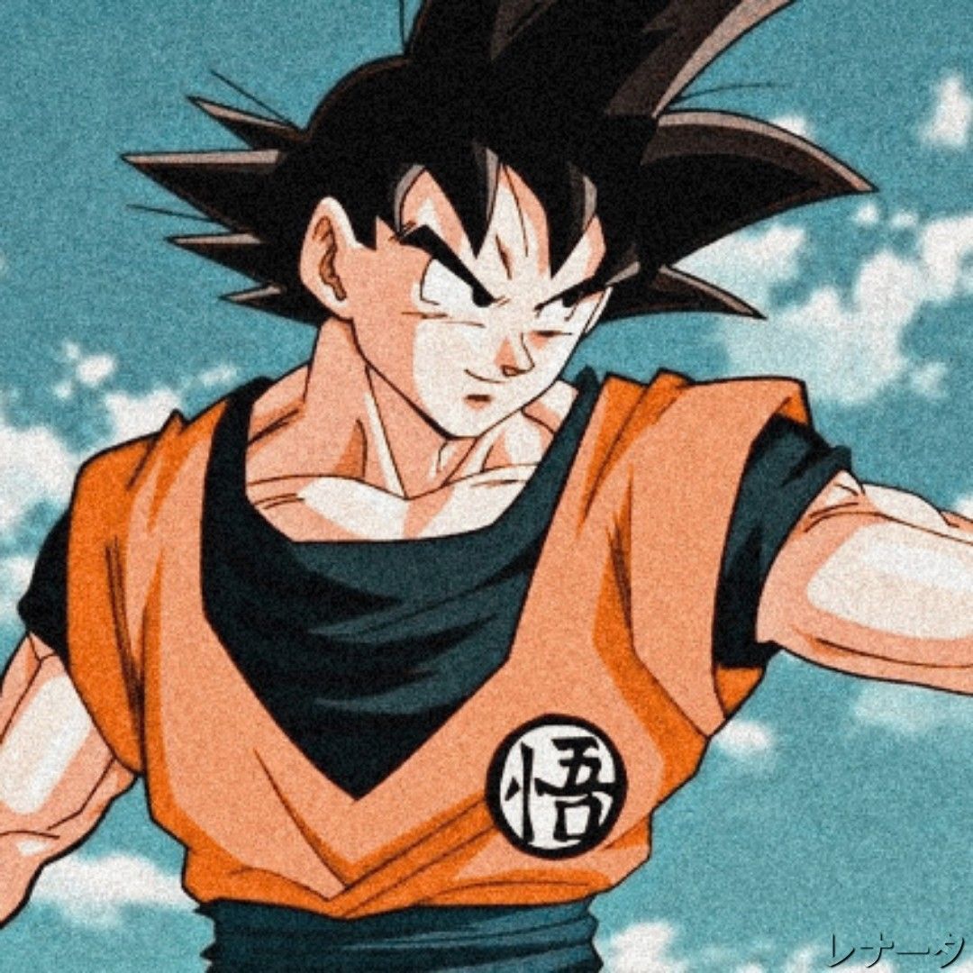 A drawing of a man with black hair, wearing an orange and black shirt with the character Gohan from Dragon Ball Z on it. - Goku