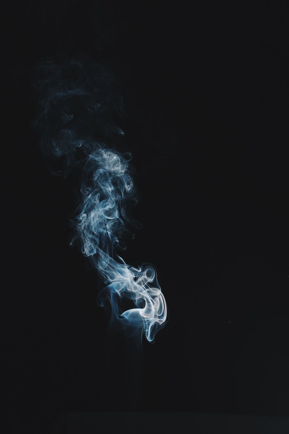 A photo of smoke on a black background - Smoke