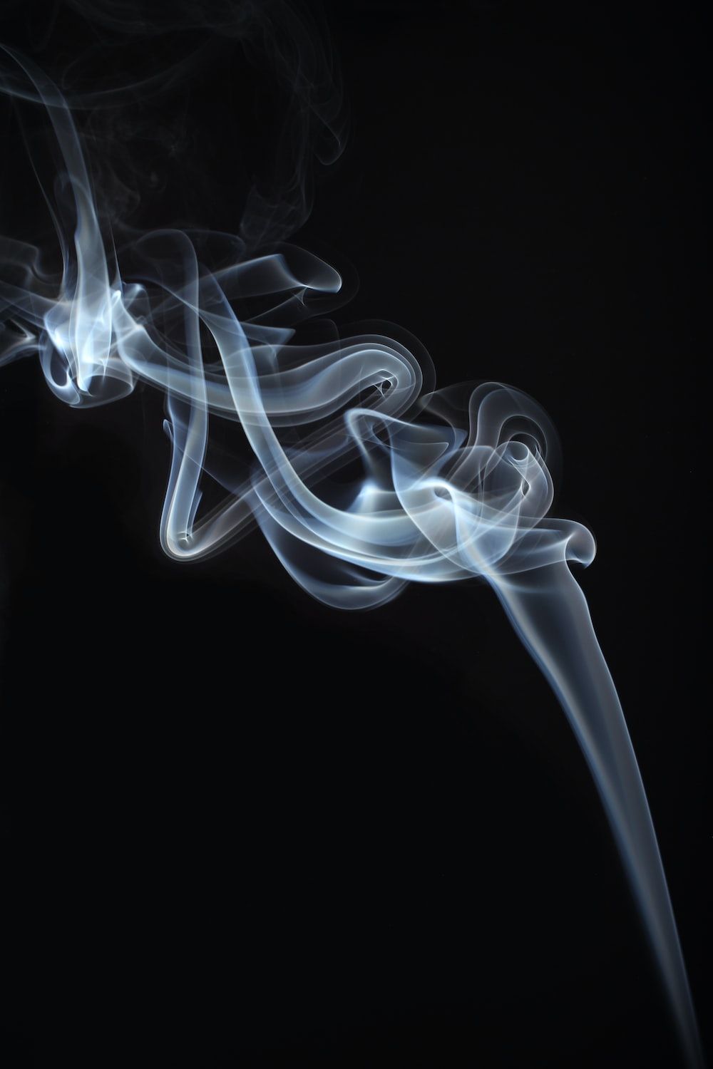 A black and white photograph of smoke - Smoke