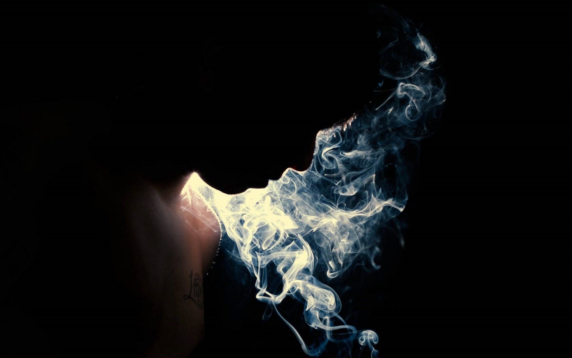 A person with smoke coming out of their mouth - Smoke