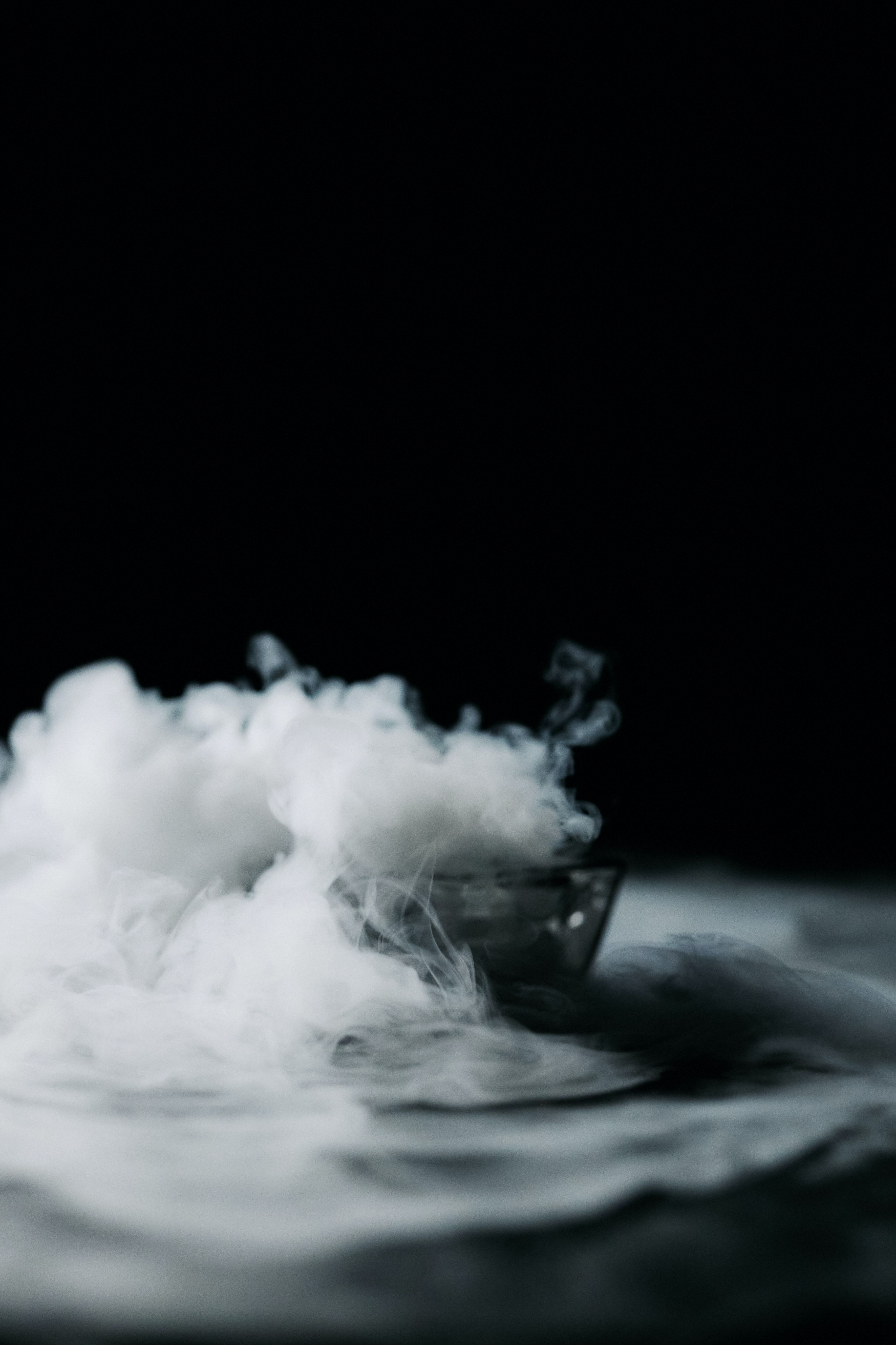 A bowl of smoke on a black background - Smoke