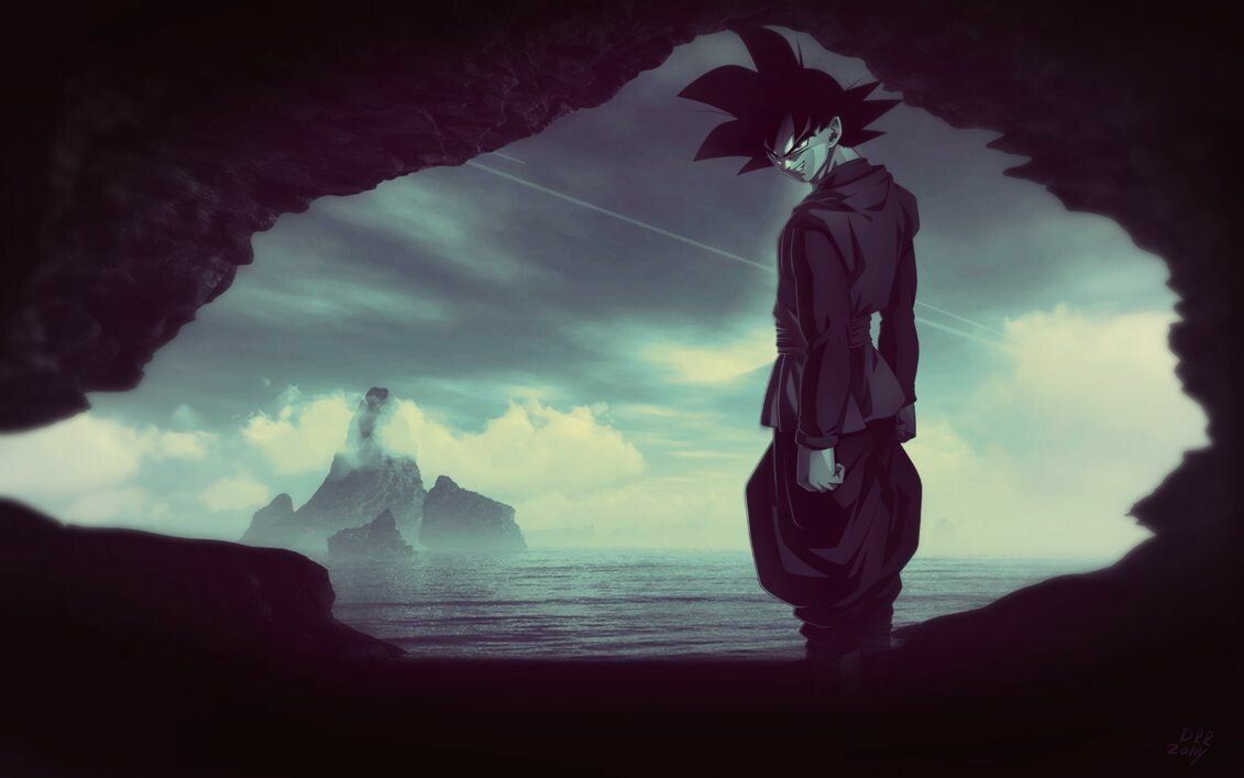 A dark haired man stands in a cave looking out at the ocean. - Goku