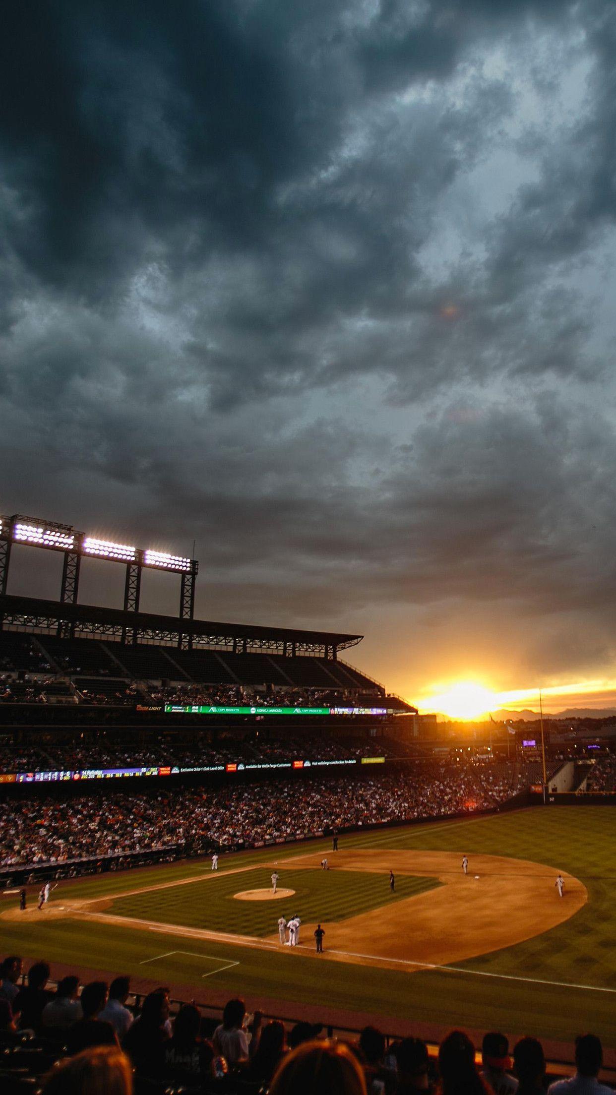 Baseball game with the sun setting in the background - Softball