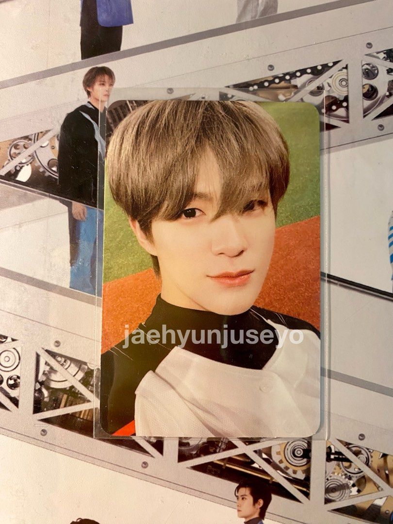 A picture of an asian man on the wall - NCT