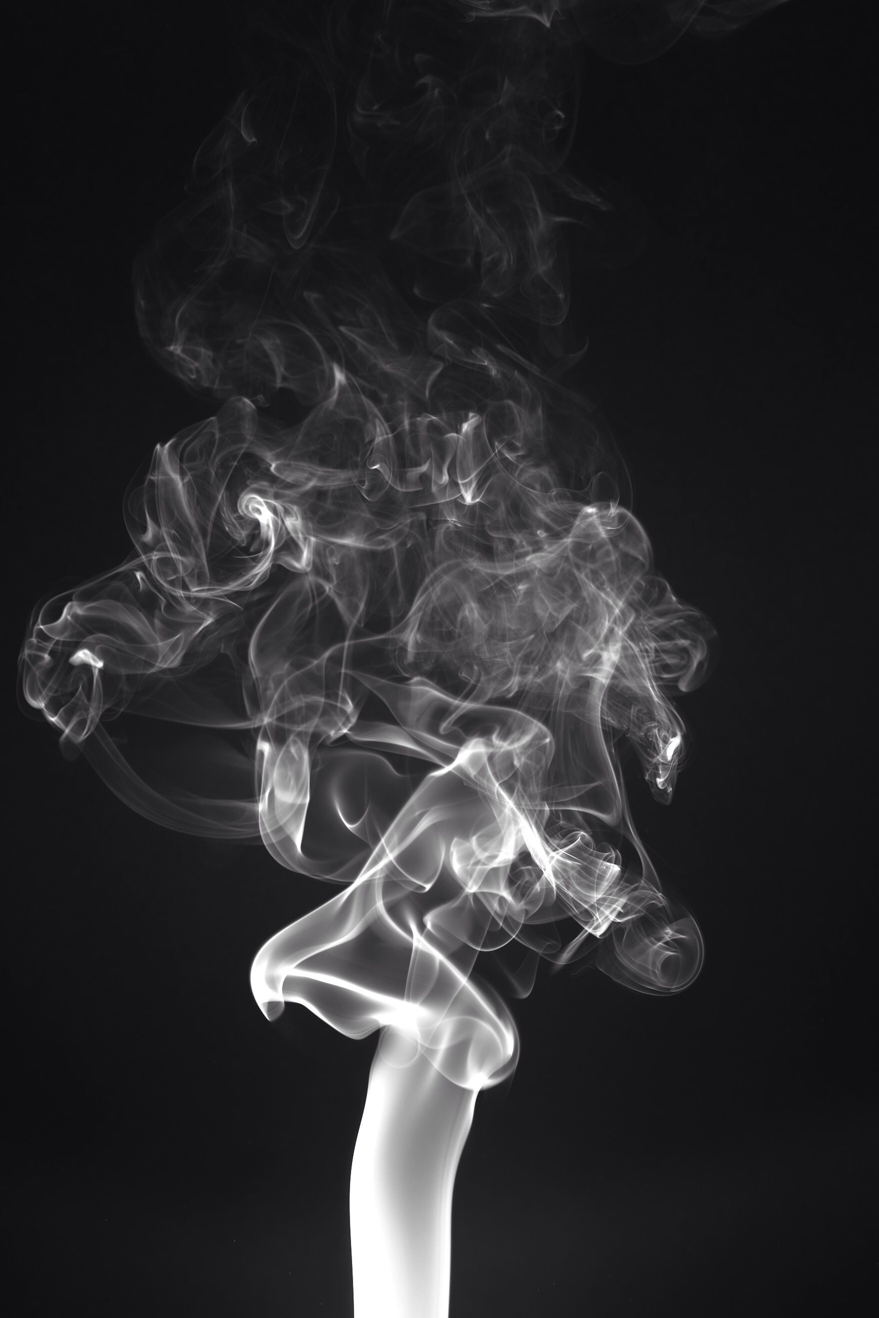Smoke rising against a black background - Smoke