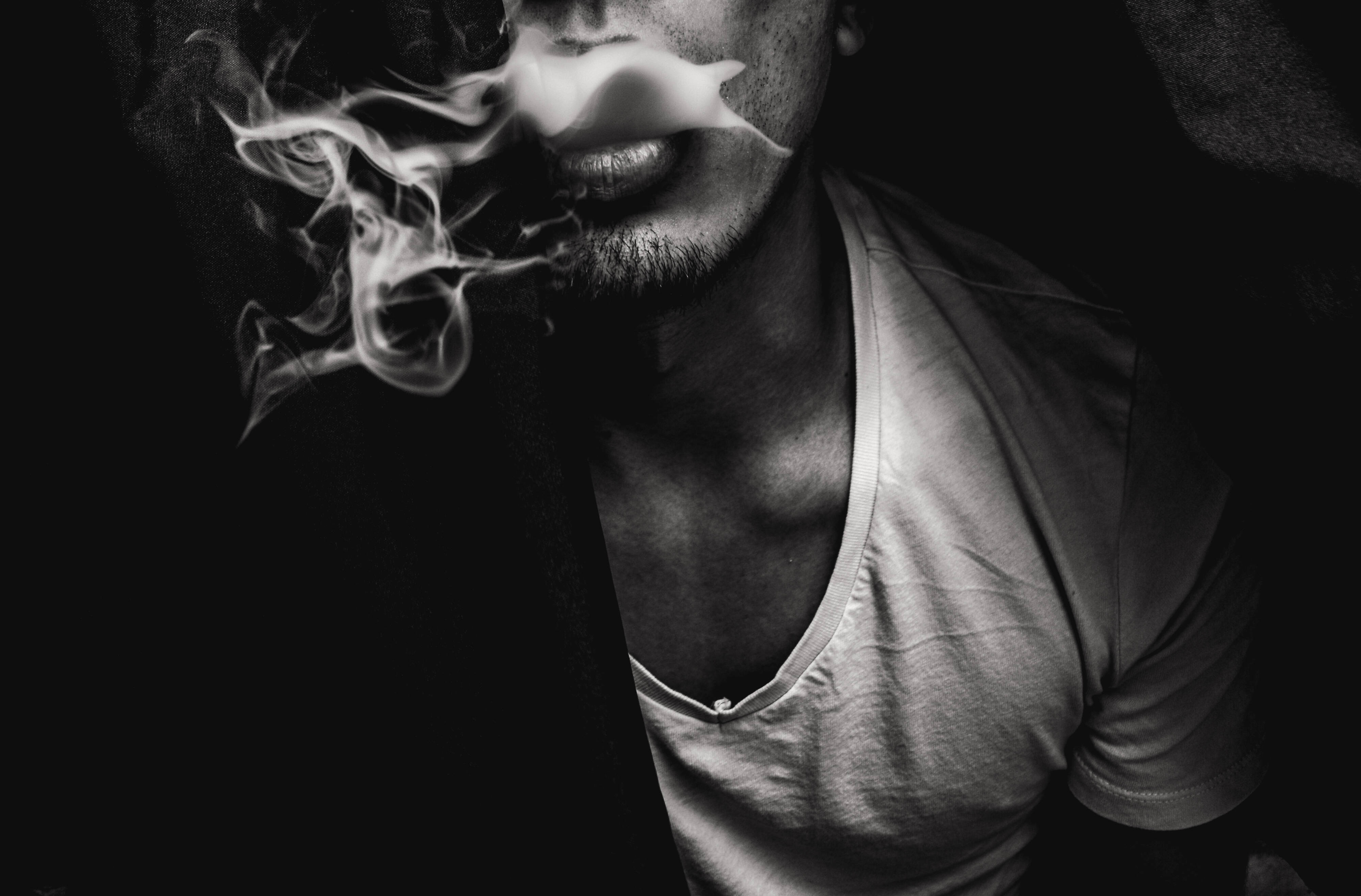 A man smoking in the dark - Smoke