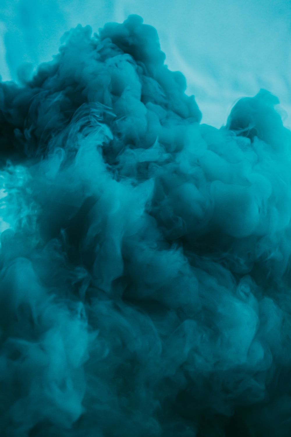 A close up of a blue smoke - Smoke