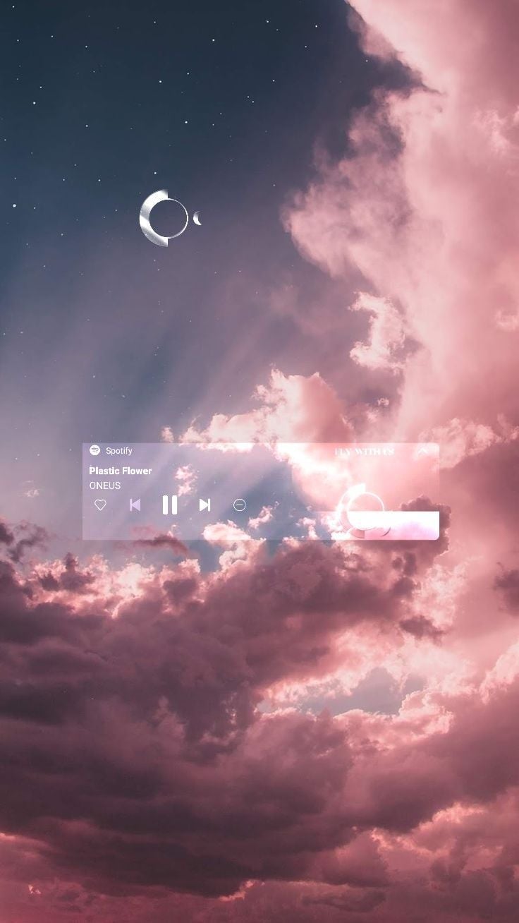 A computer screen with clouds and the moon in it - Spotify, music