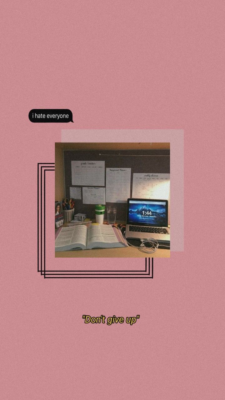 Aesthetic pink background with a laptop and book on a desk - Study