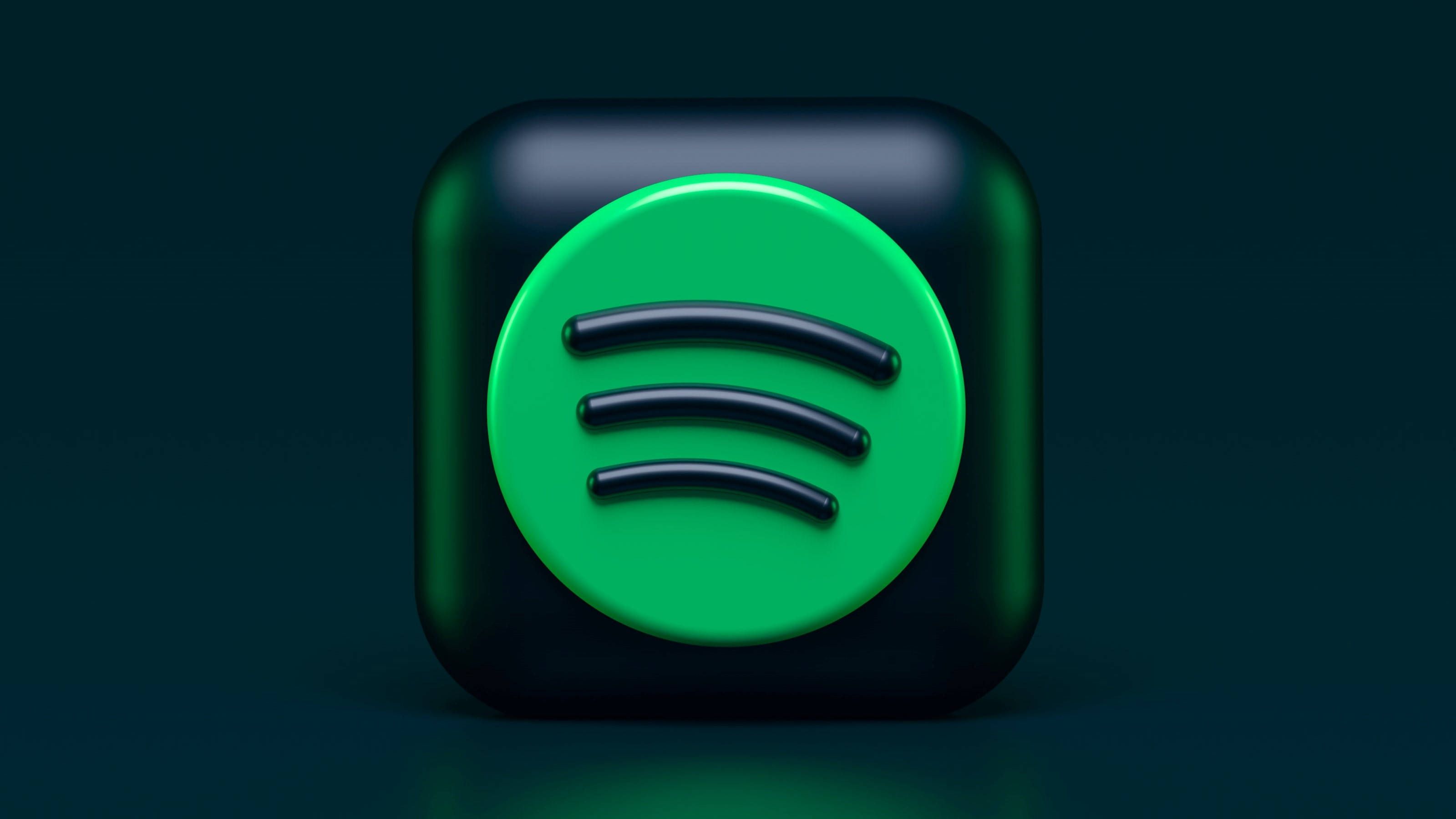 A green button with the sound logo on it - Spotify, 3D