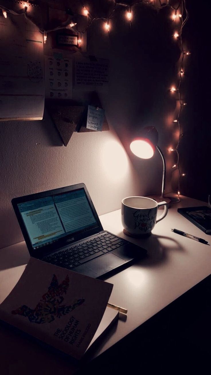 A laptop computer and coffee cup on the desk - Study