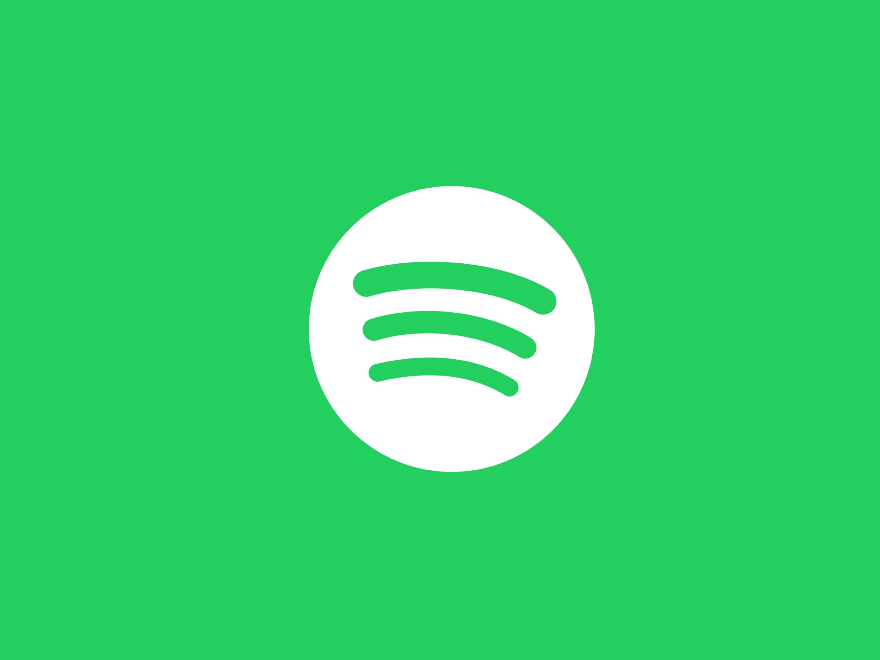 A green background with the logo for spotify - Spotify