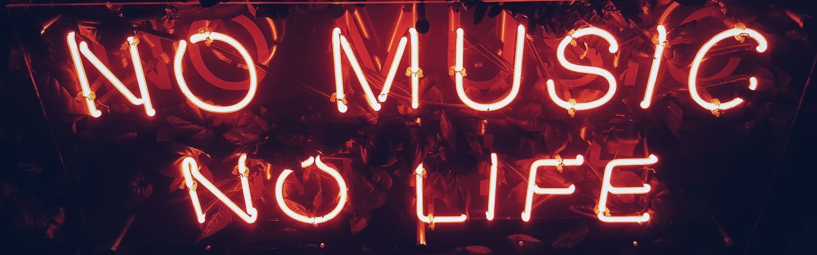 A neon sign that says no music, life - Spotify