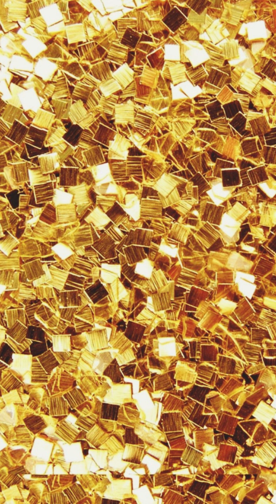 A close up of gold glitter on the ground - Gold