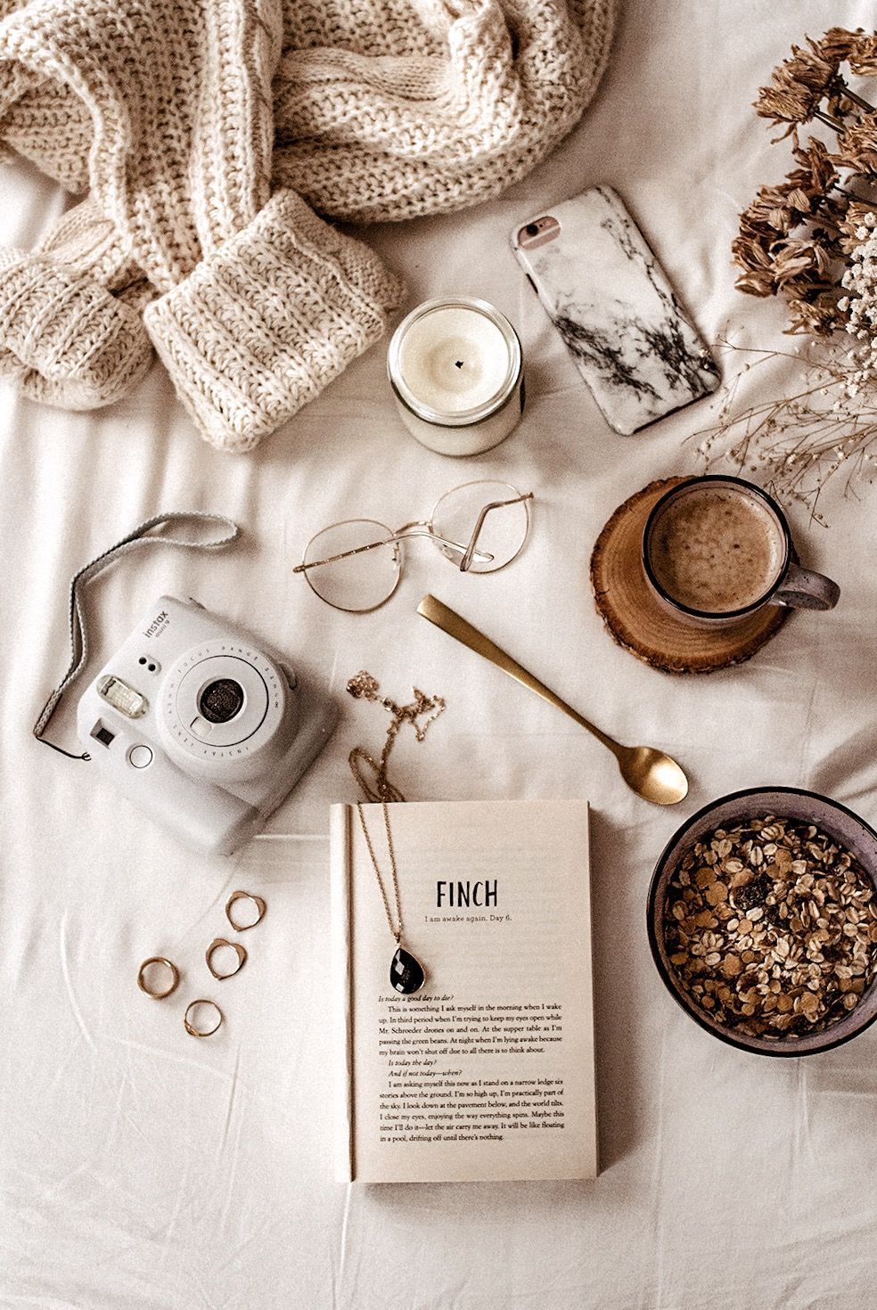 A book, coffee and other items on the bed - Cozy, flat lay