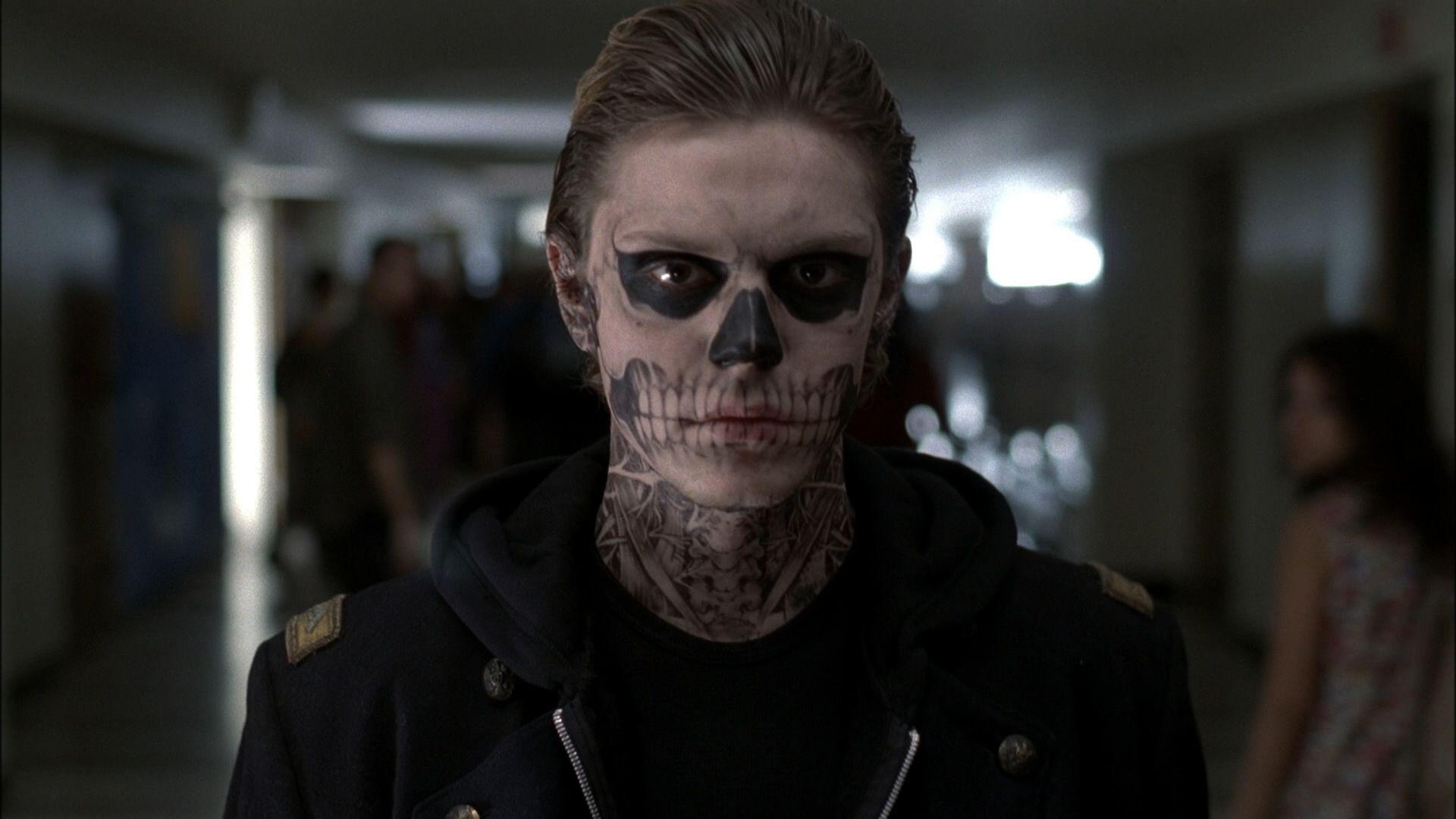 Tate, the main antagonist of the show, with his face painted like a skull. - Evan Peters