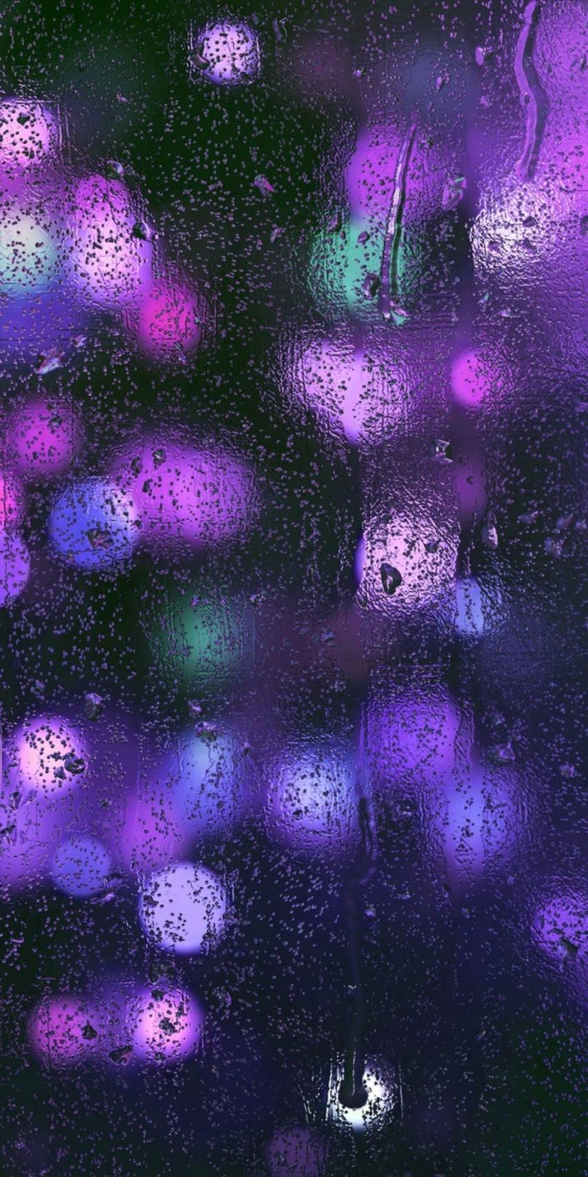 A purple and blue abstract background image of a rain covered window - Dark purple