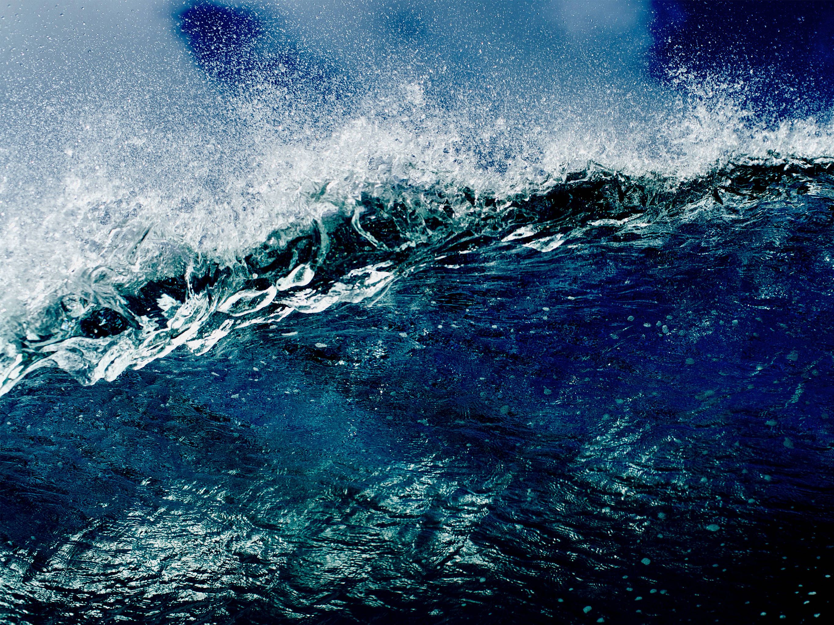 A wave crashes in the deep blue ocean - Wave