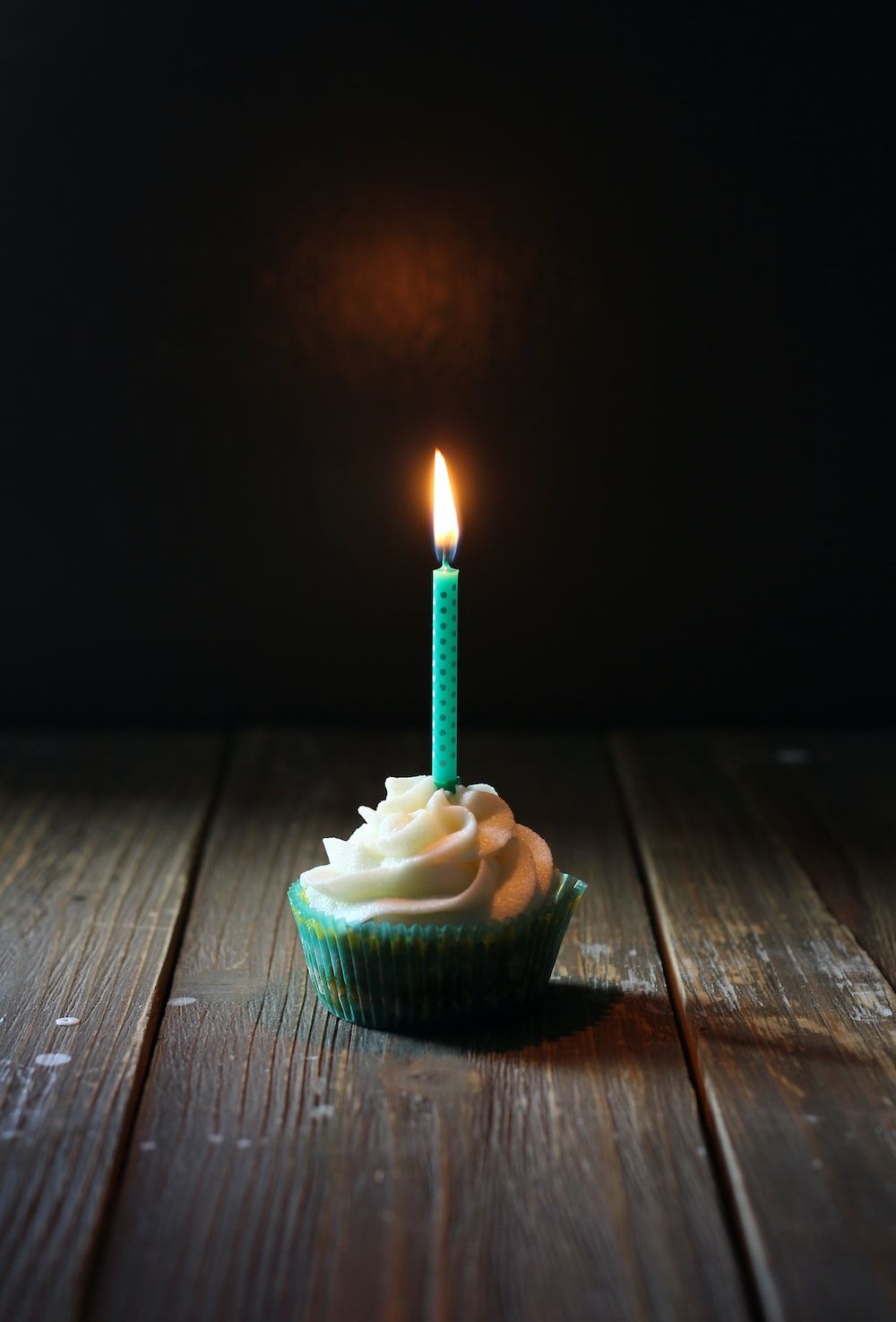 A cupcake with one candle on top - Birthday