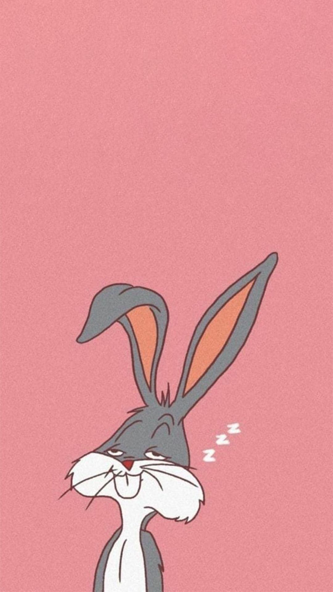 A cartoon rabbit with big ears is sleeping on pink background - Bugs Bunny, Looney Tunes