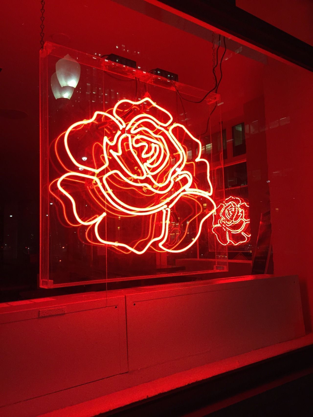 A red neon sign of a rose - Bright, red, neon red