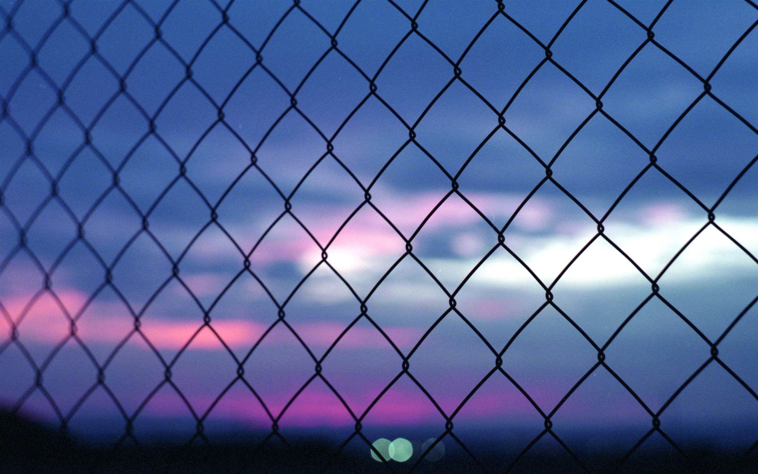 A fence in front of a beautiful sunset - Diamond