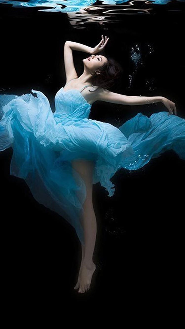 A woman in blue dress is underwater - Dance, ballet