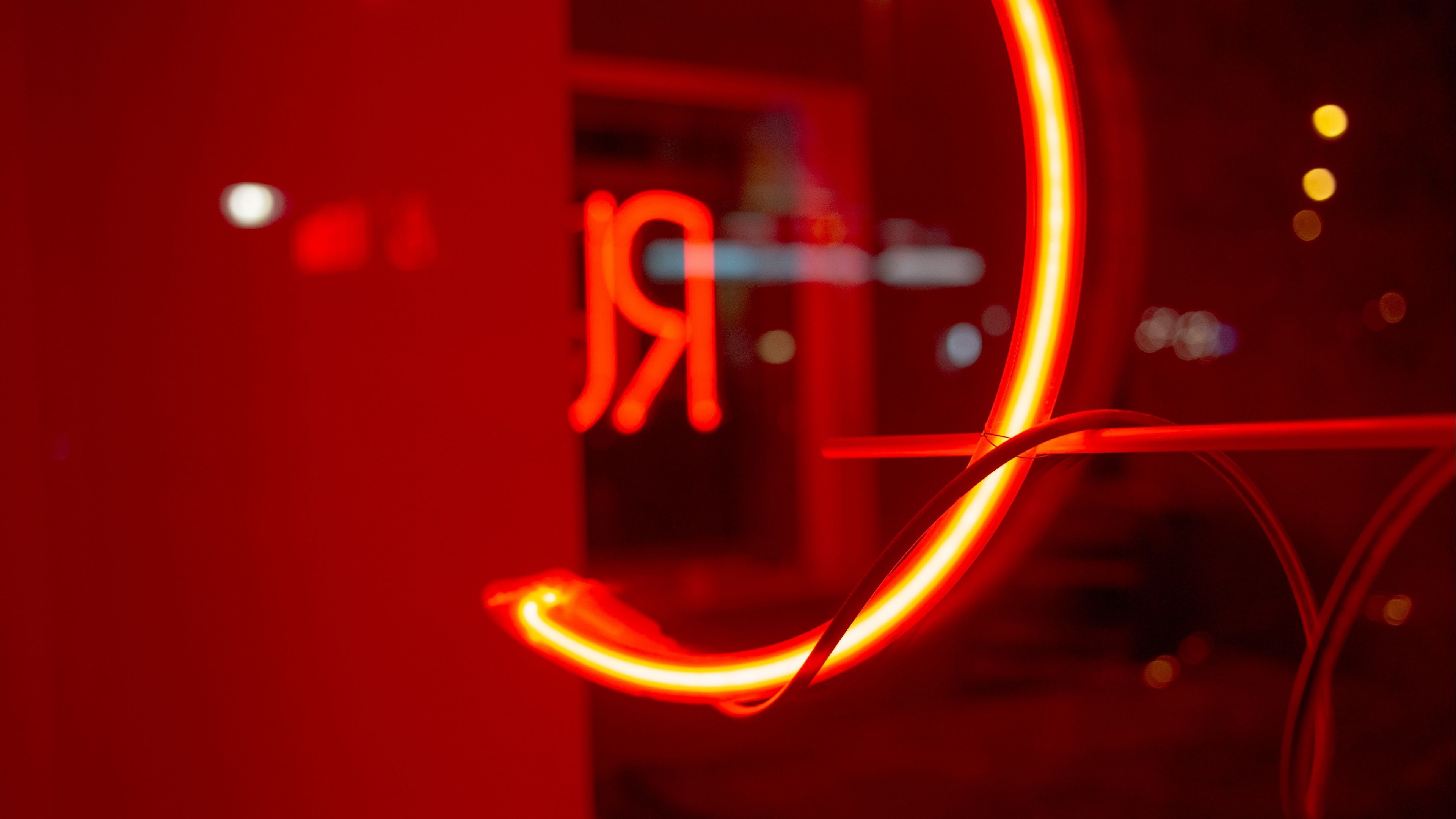 A neon light that is red and round - Neon red